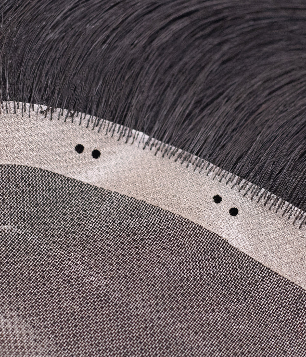 Bead-In Human Hair Topper - Mono Base 3x5 - close-up of micro-bead installation holes on the cap edge
