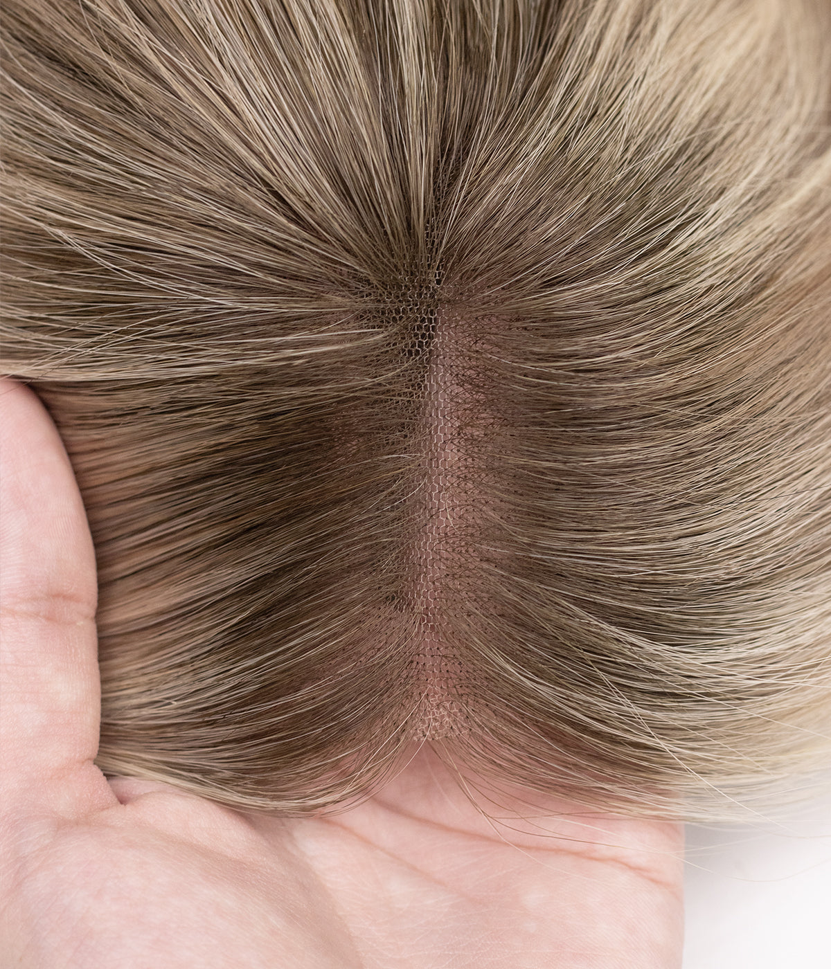 Human Hair Topper - No-Trim Lace 6.5x7 - close-up of natural lace parting and scalp-like base held in hand