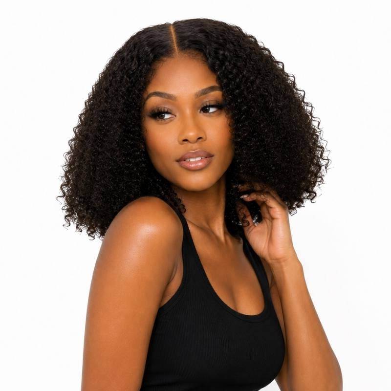 Model looking to the side with a hand at her hair wearing a kinky curly coffee brown bob human hair wig with a middle part