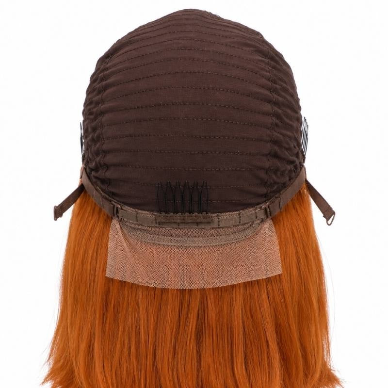 Inside back of the cap on a cinnamon orange ginger bob human hair wig showing side combs, a nape comb, adjustable straps and mesh panel