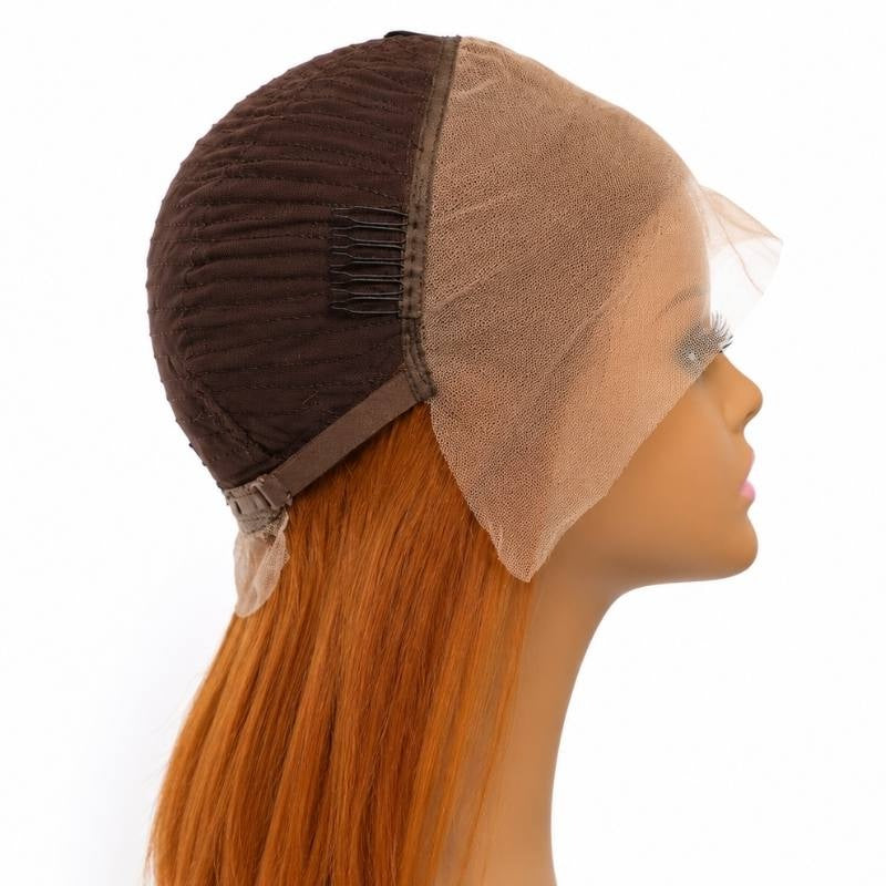 Cap interior of a cinnamon orange ginger bob human hair wig turned inside out on a mannequin showing a side comb and the lace front panel