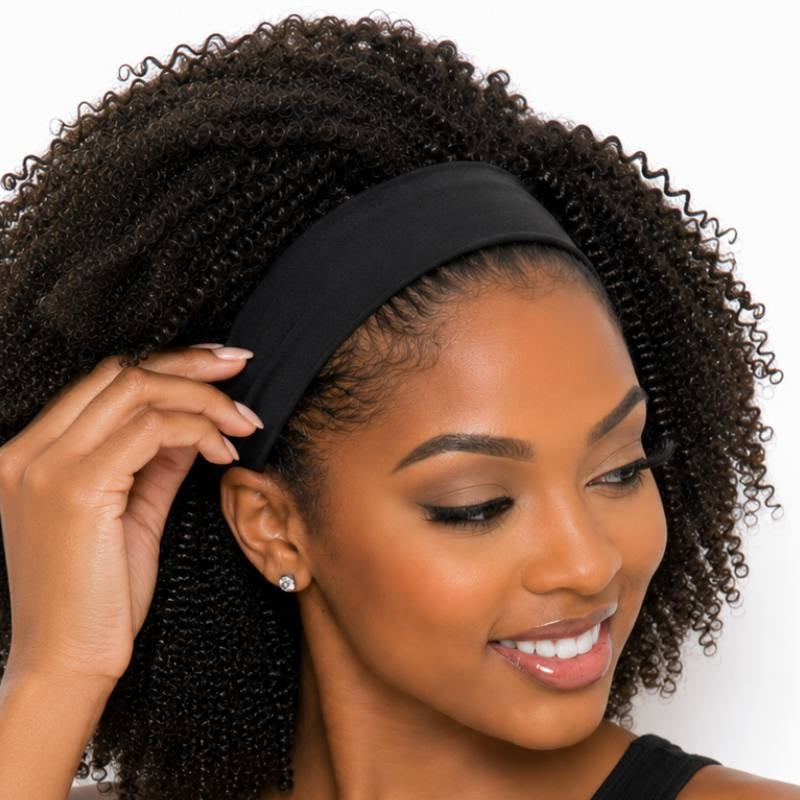 Model adjusting the black stretch band on an afro kinky curly natural black headband human hair wig in a close cropped smiling shot