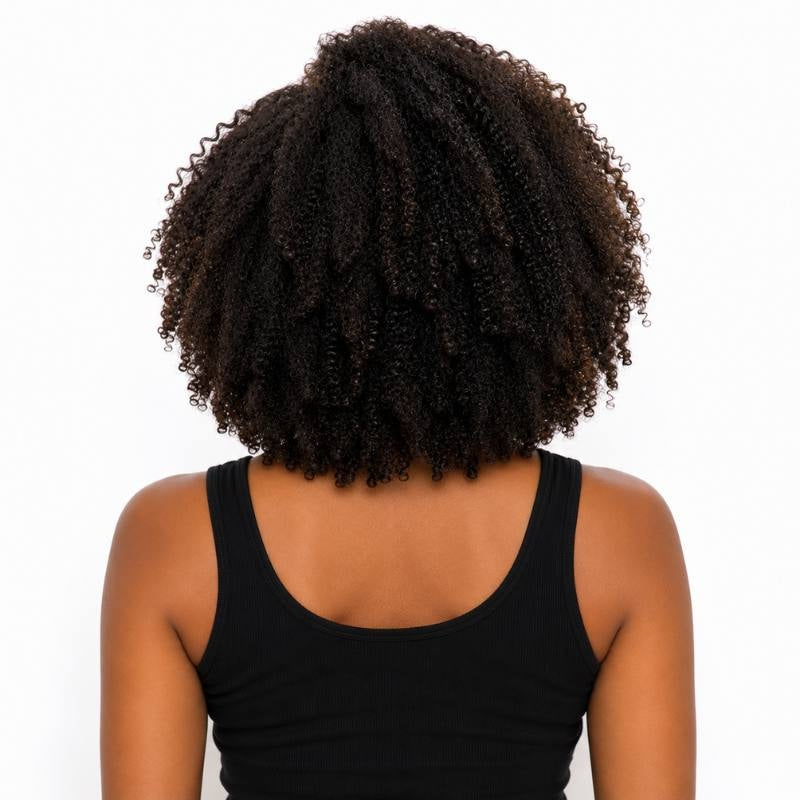 Back view of a model wearing an afro kinky curly natural black headband human hair wig showing the coil pattern and the rounded shape at the back