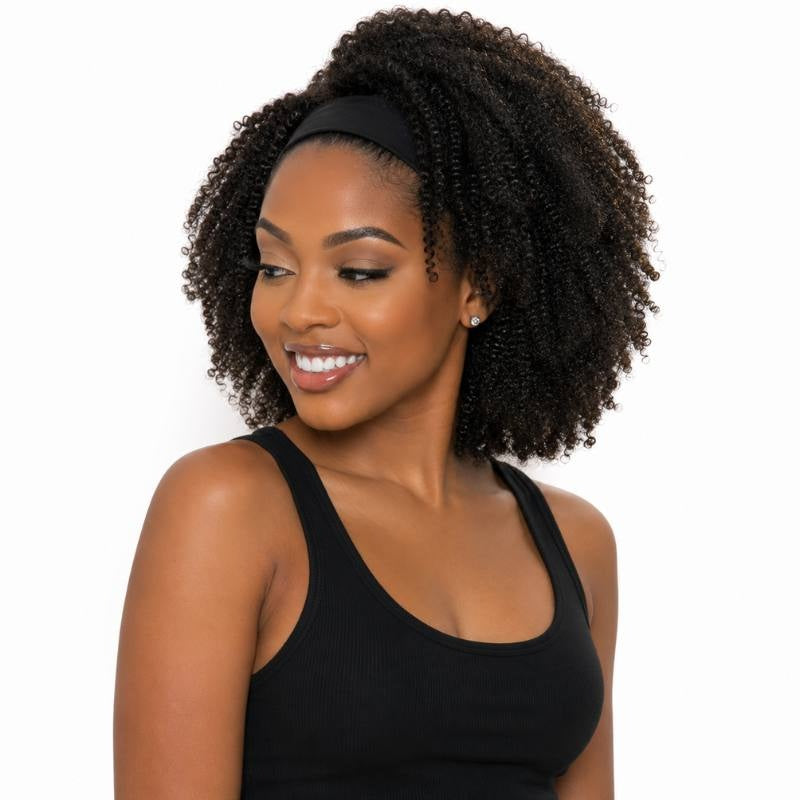 Model looking down and to the side wearing an afro kinky curly natural black headband human hair wig with the band at the hairline