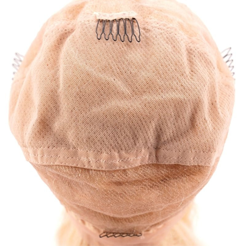 Overhead view of the cap interior on a blonde body wave human hair wig showing the mesh dome and metal combs stitched at the crown and sides