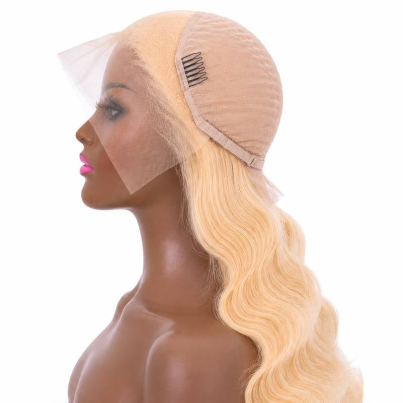 Blonde body wave human hair wig on a mannequin with the cap folded to show a stitched comb, the mesh dome and the transparent lace front