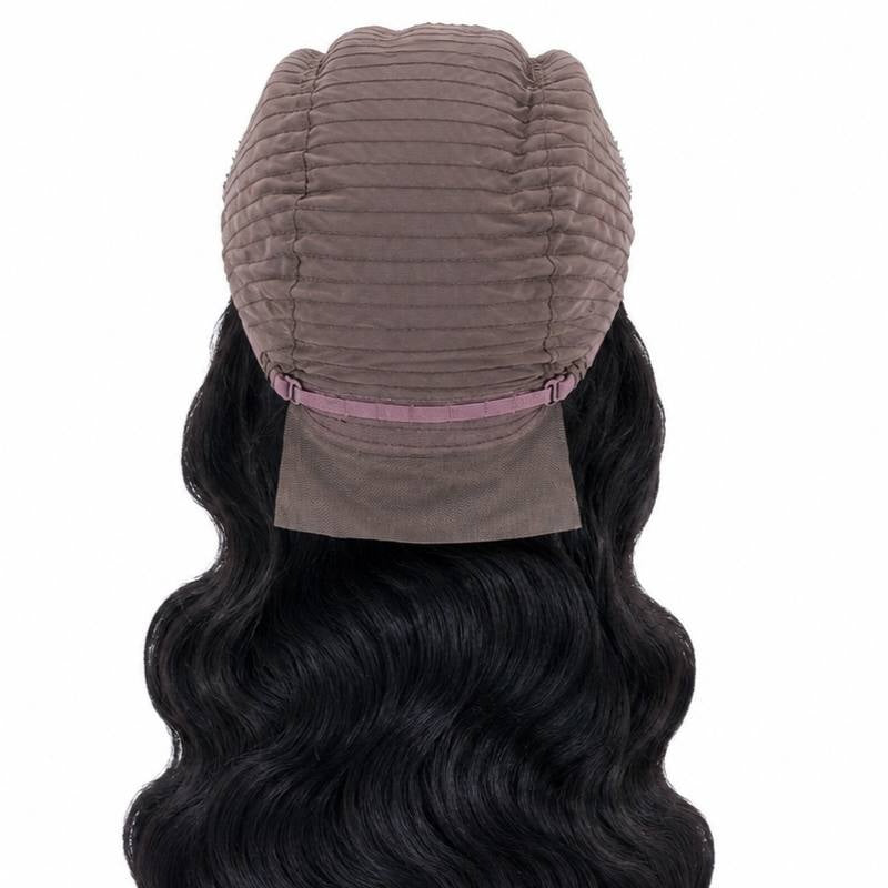 Inside back of the cap on a body wave natural black human hair wig showing the wefted dome, adjustable strap and mesh nape panel