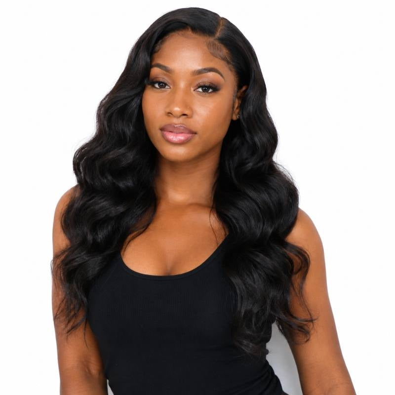 Model facing the camera wearing a long body wave natural black human hair wig parted to one side with waves over both shoulders