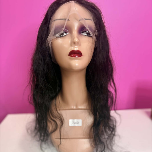 Front view of 18 inch body wave full transparent lace human hair wig on mannequin showing lace cap and loose waves