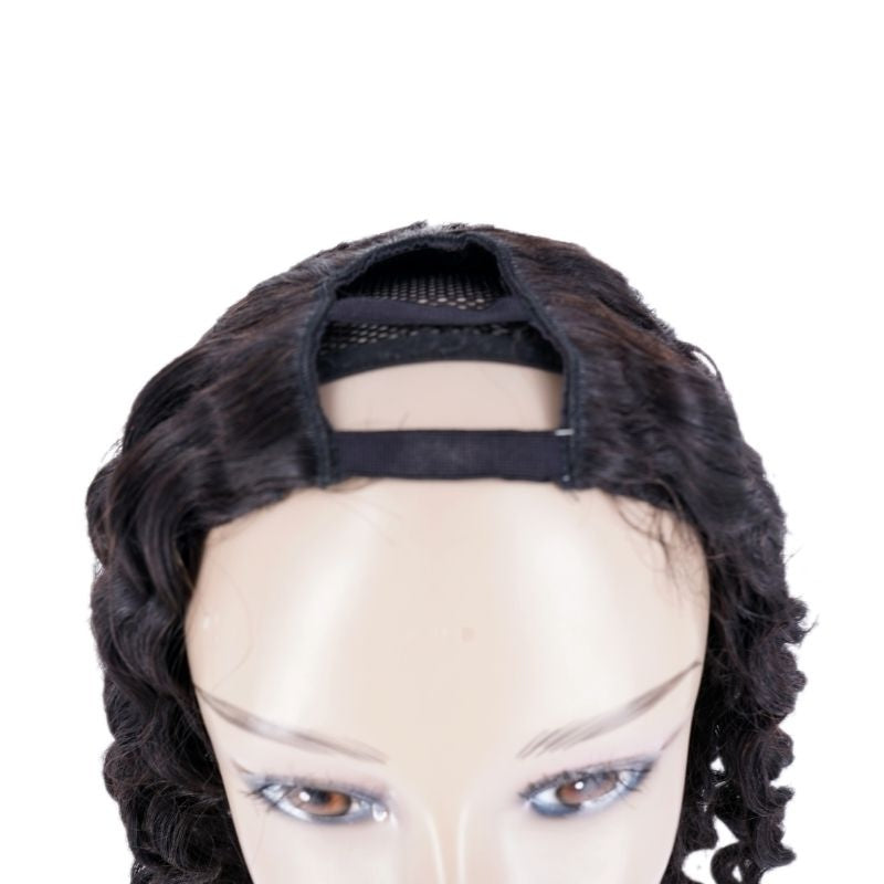 Cropped view of the crown on a natural black deep wave human hair wig on a mannequin with the U part mesh opening and elastic band