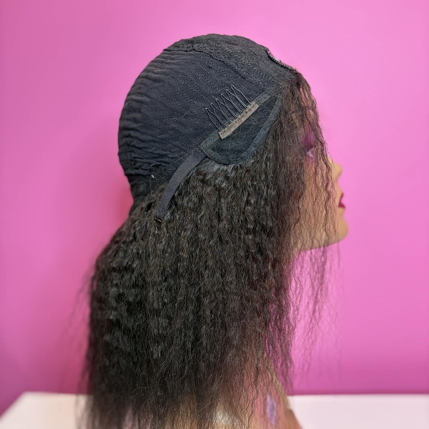 Right side of model wearing 12 inch kinky straight u-part human hair wig showing seamless blend with natural hair