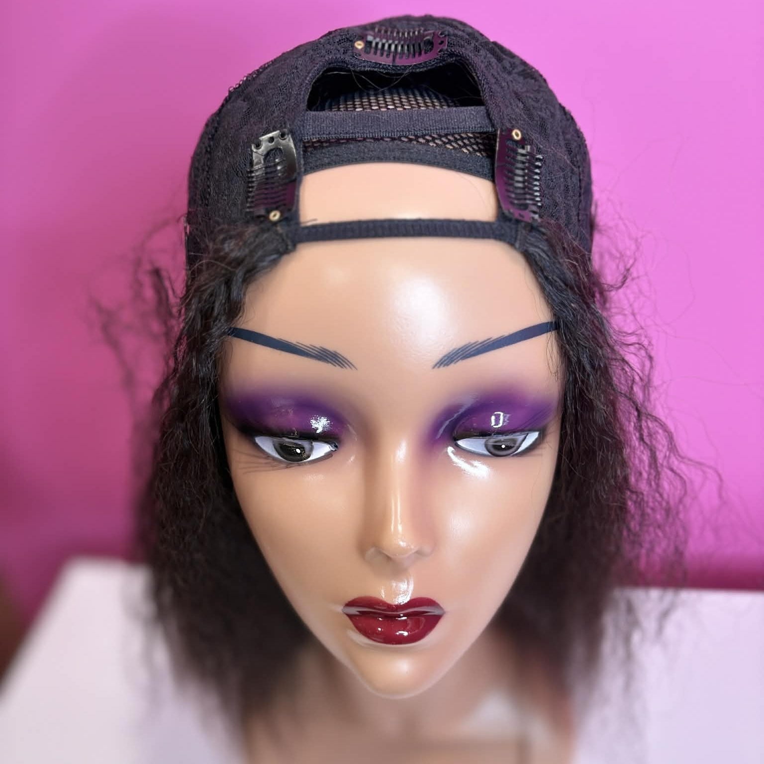 Top view of 12 inch kinky straight u-part human hair wig showing mesh cap construction and u-shaped opening detail