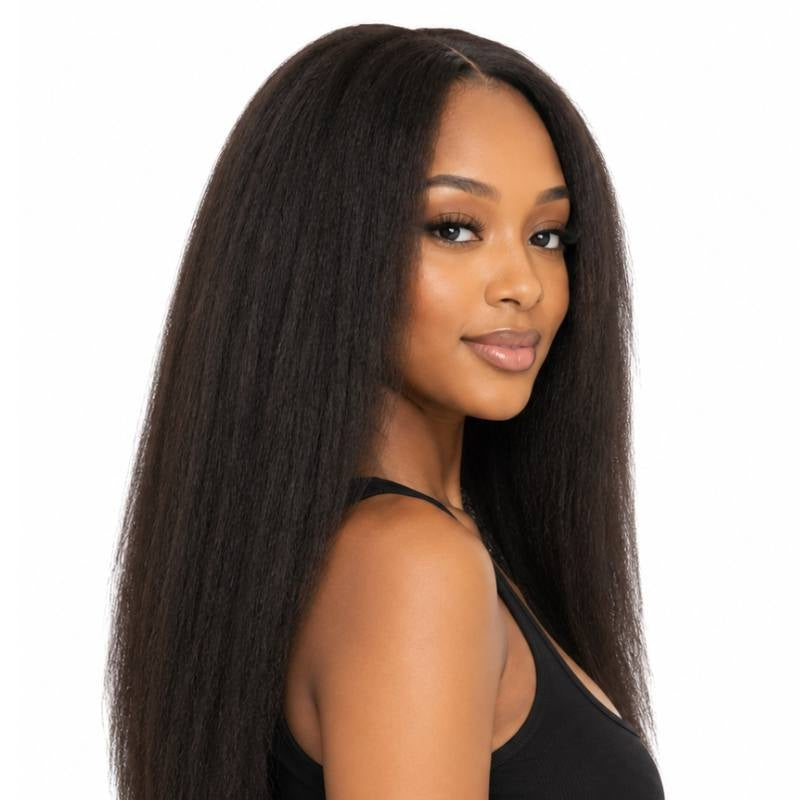 Model turned to the side wearing a natural black kinky straight human hair wig with the coarse straight texture visible down the length