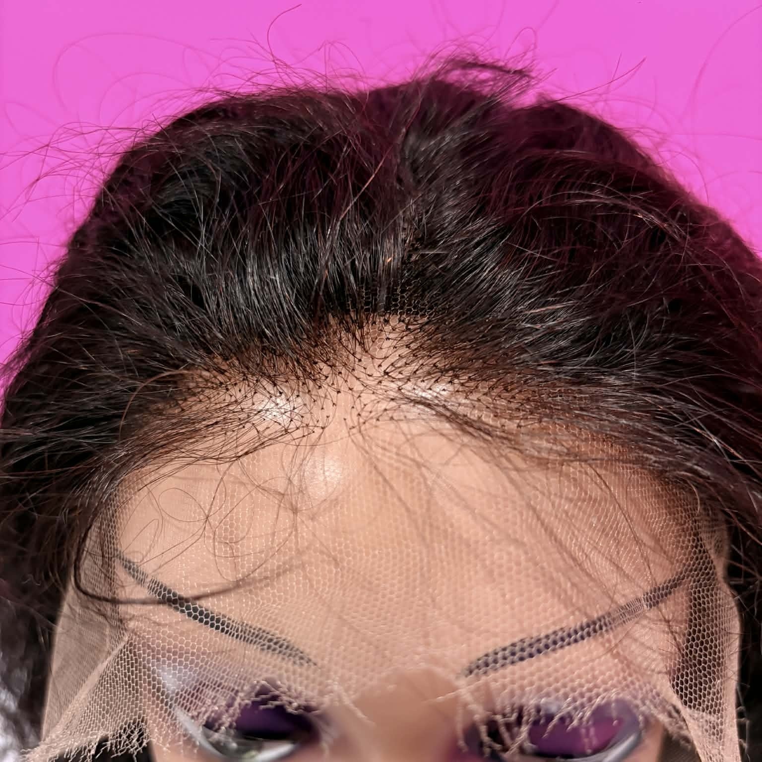 Close-up of HD lace hairline on 22 inch deep wave 13x4 lace front human hair wig showing transparent lace and pre-plucked baby hairs