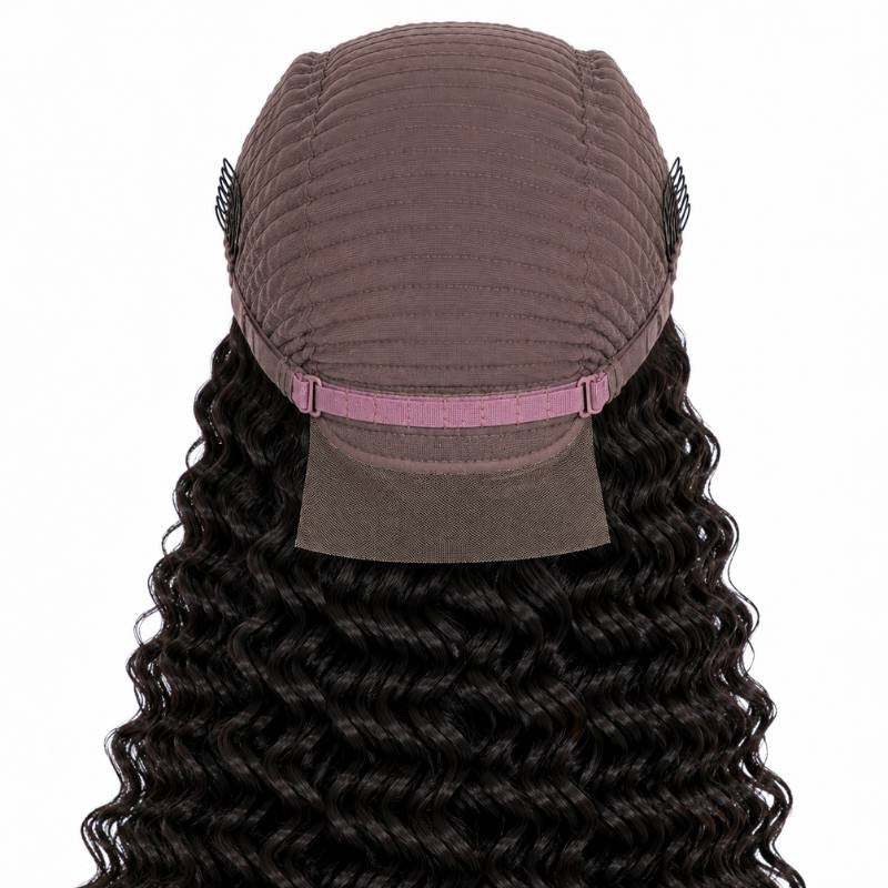 Cap of a natural black deep wave human hair wig turned to show the interior dome, adjustable strap and the lace panel at the front