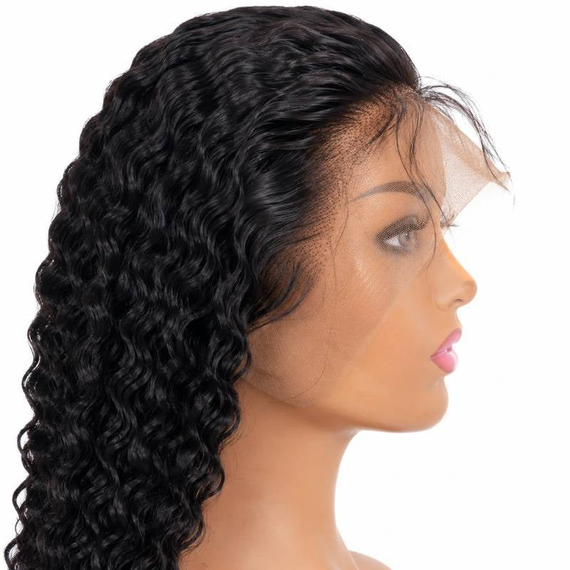 Natural black deep wave human hair wig on a mannequin in profile with the transparent lace edge still uncut past the hairline