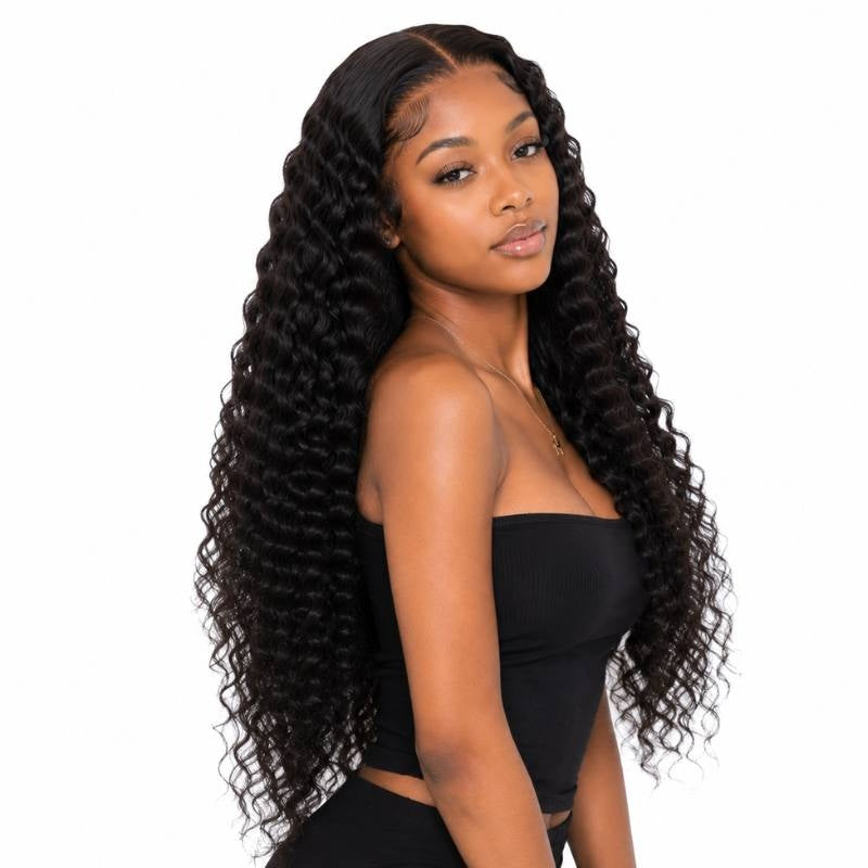 Model turned to the side wearing a natural black deep wave human hair wig with a middle part and crimped waves past the waist