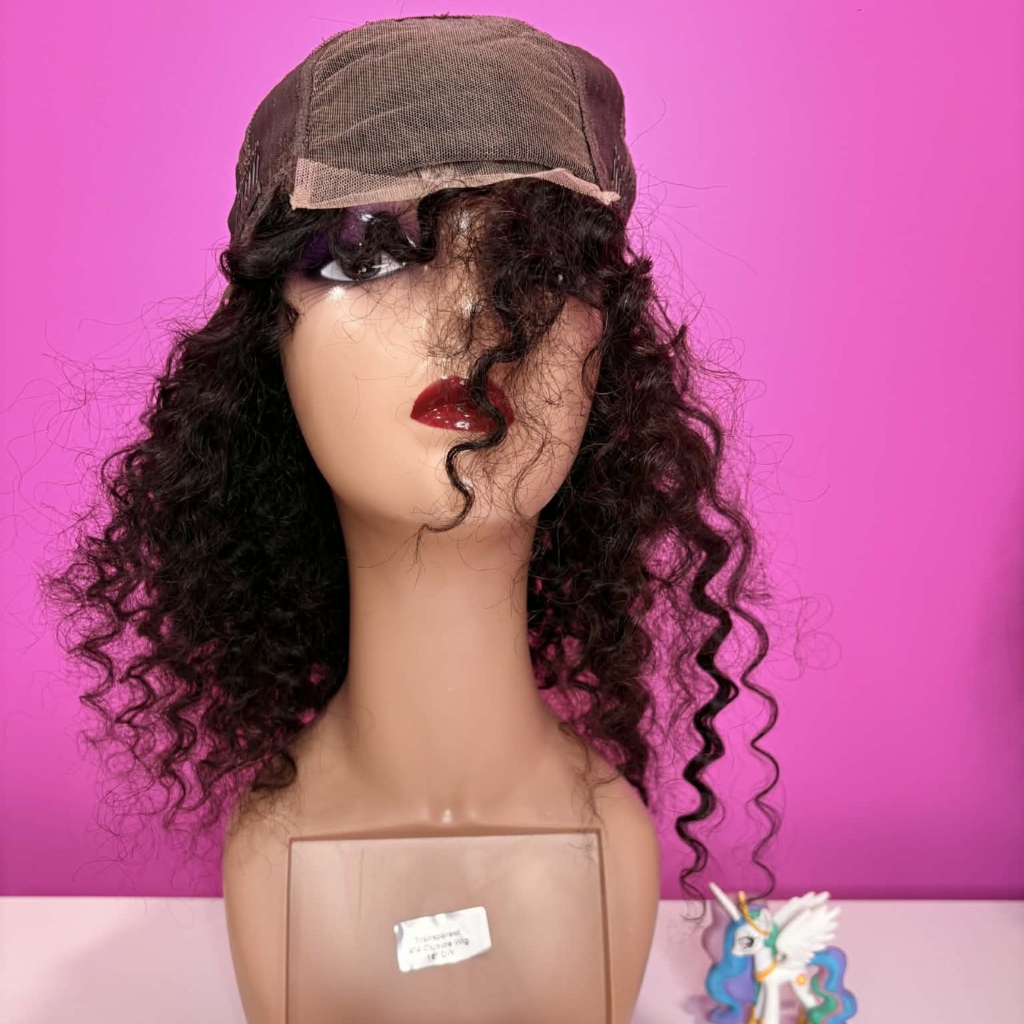 Interior front cap view of 16 inch deep wave human hair wig showing 4x4 transparent lace closure area and cap structure