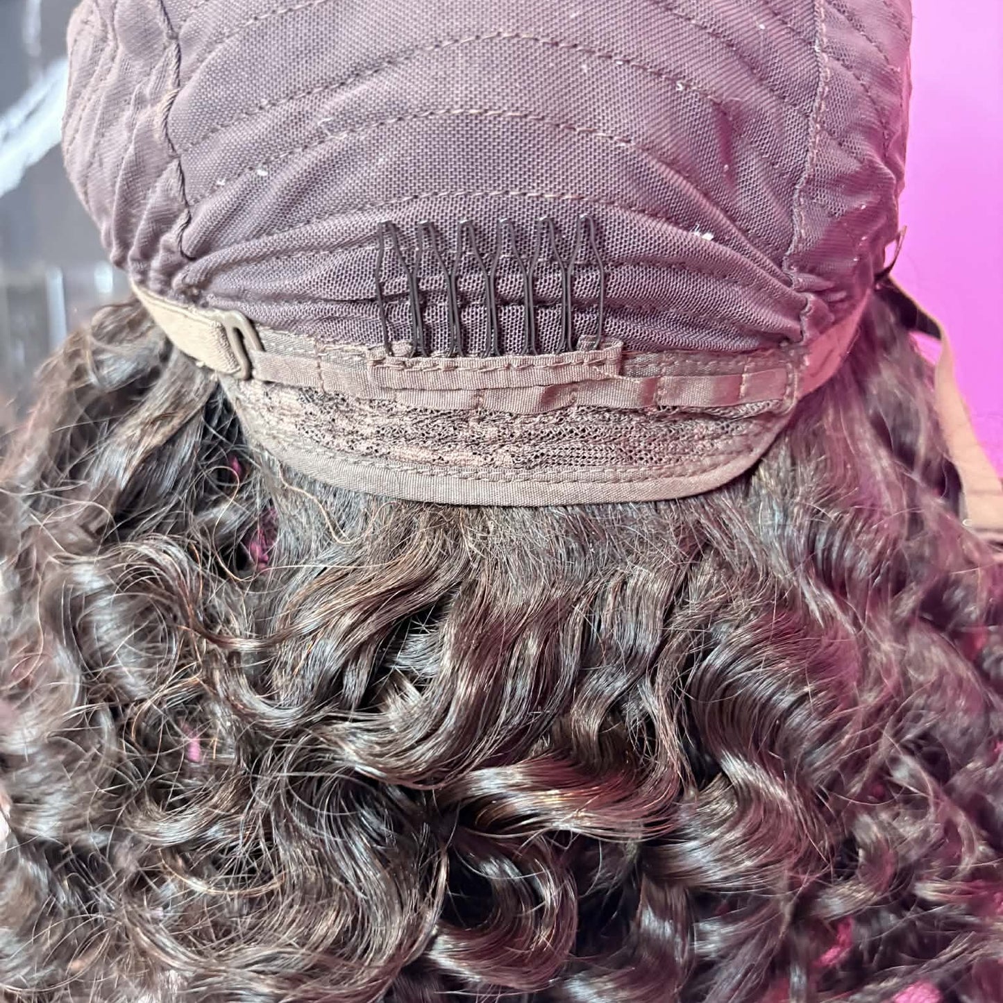 Close-up interior cap detail of 16 inch deep wave closure human hair wig showing lace closure construction and weft rows