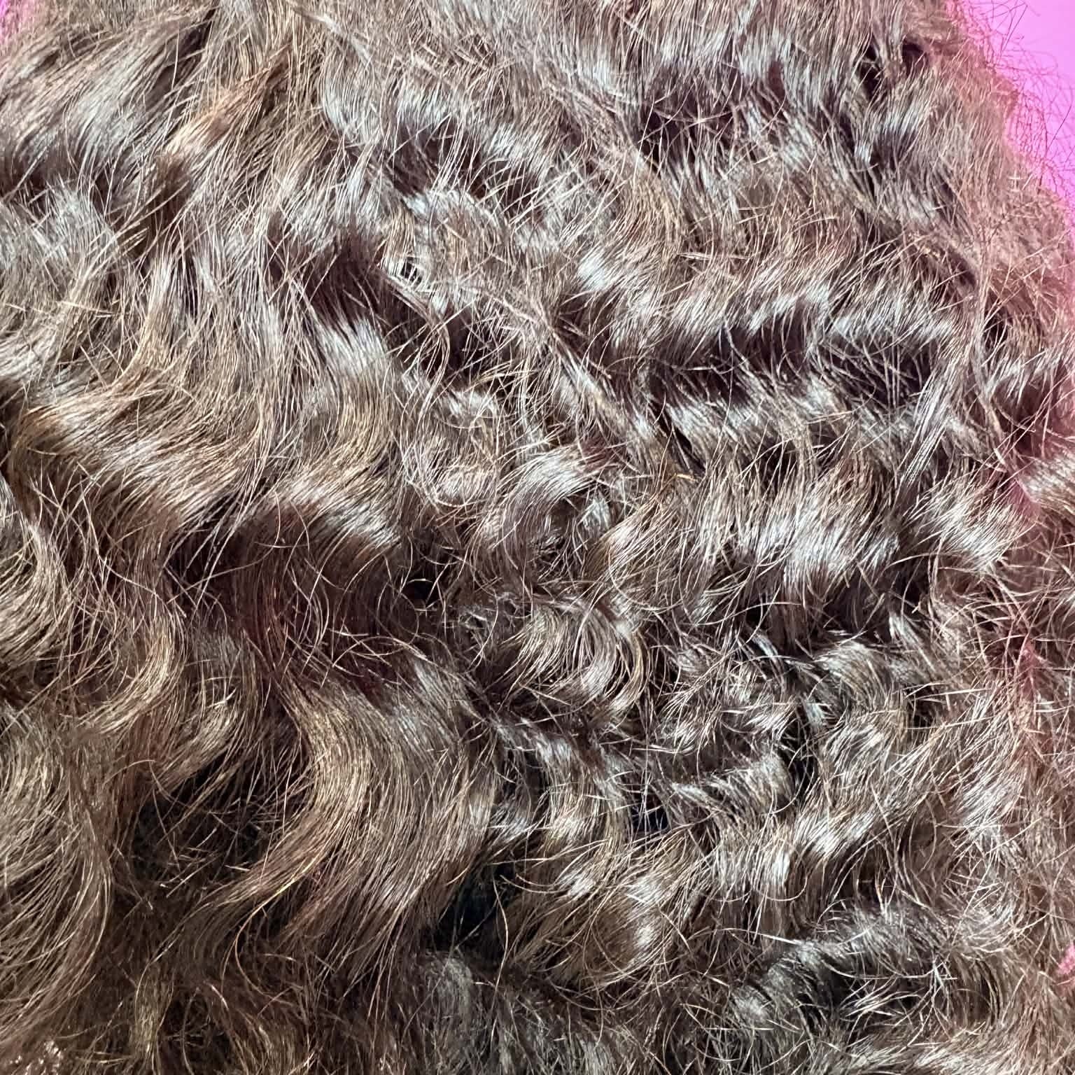 Macro close-up of deep wave curl texture on 16 inch closure human hair wig showing defined S-spiral pattern and shine