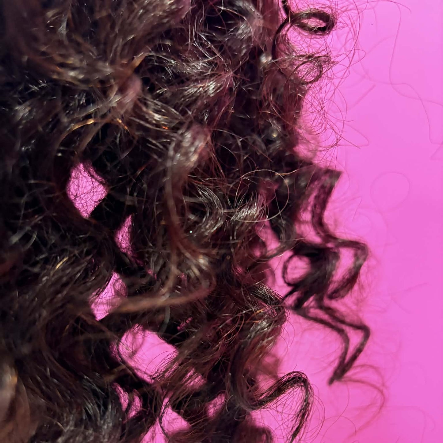 Close-up of deep wave curl pattern on 14 inch headband human hair wig in natural black showing defined curls and natural shine