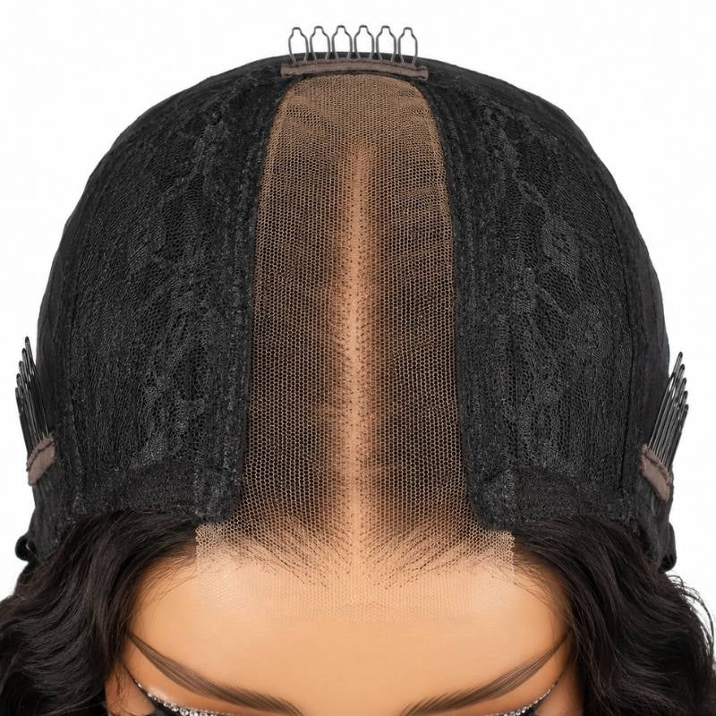 Top down view of the cap on a natural black body wave human hair wig showing the narrow lace closure strip and combs beside it