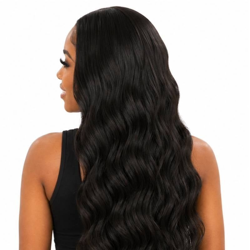 Back view of a model wearing a natural black body wave human hair wig with the waves spreading across the shoulders and back