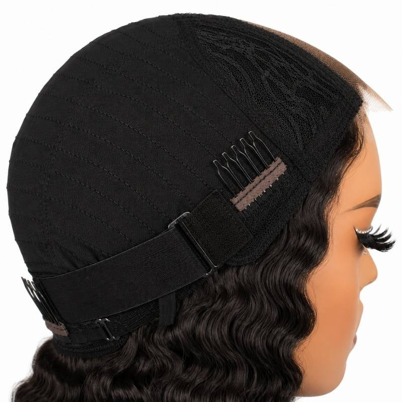 Cap of a natural black deep wave human hair wig turned back on a mannequin showing a comb, the elastic band and the lace at the front