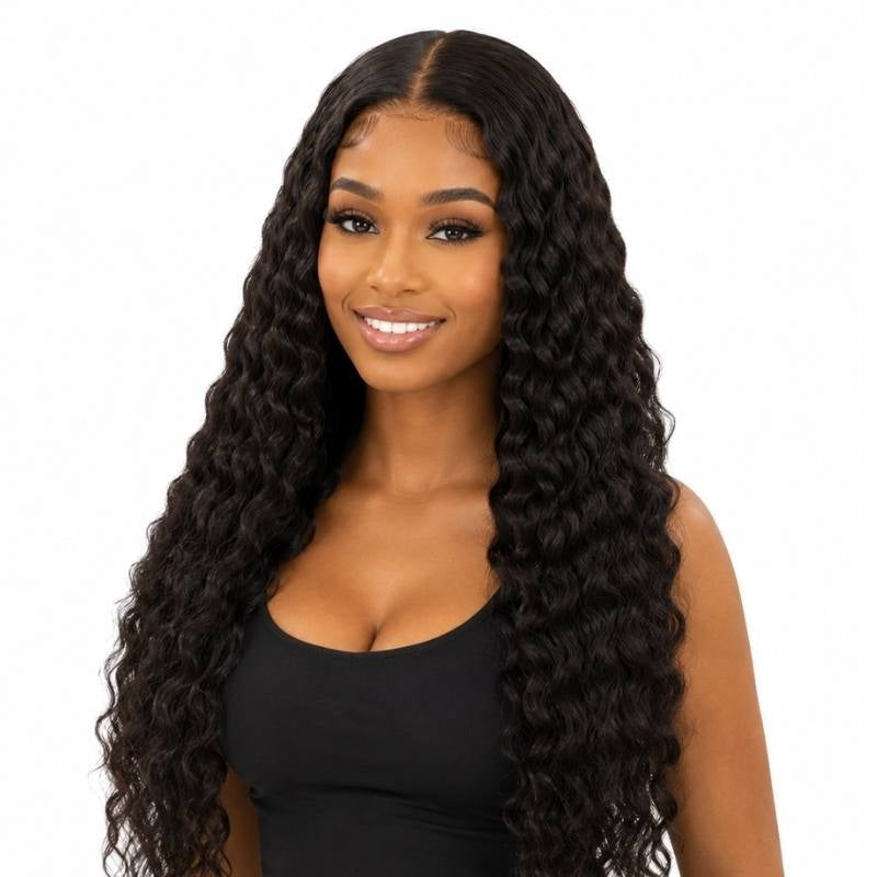 Model wearing a natural black deep wave human hair wig with a middle part, laid edges and crimped waves falling past the waist