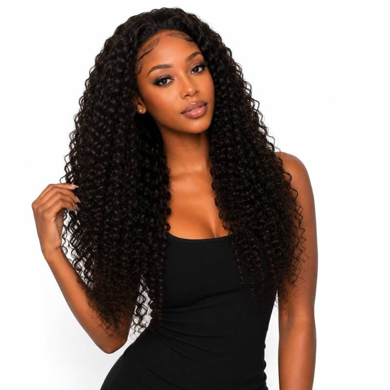 Model wearing a natural black kinky curly human hair wig with a middle part and long coils held out to one side