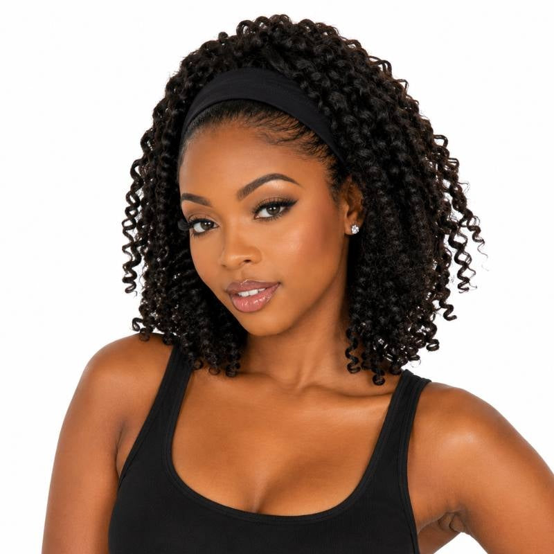 Model wearing a natural black kinky curly human hair wig with a black headband and coils falling to the shoulders