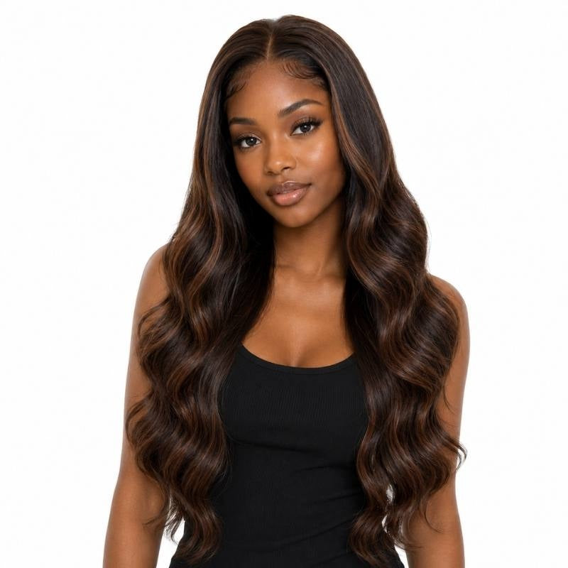 Model wearing a natural black body wave human hair wig with chocolate brown balayage streaks through the lengths and a middle part