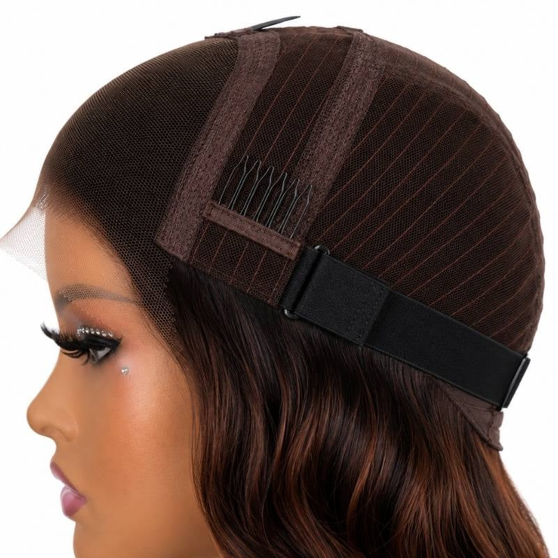 Side of a body wave human hair wig cap on a mannequin showing a comb, the elastic band and copper toned strands in the hair below