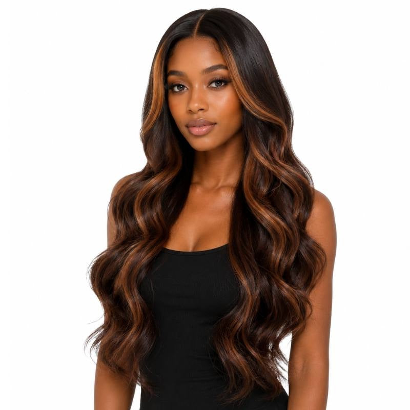 Model wearing a natural black body wave human hair wig with chocolate brown and copper balayage framing the face and running through the waves