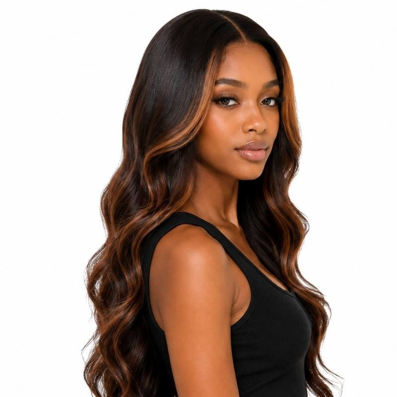 Model in a three quarter turn wearing a natural black body wave human hair wig with chocolate brown and copper balayage through the mid lengths