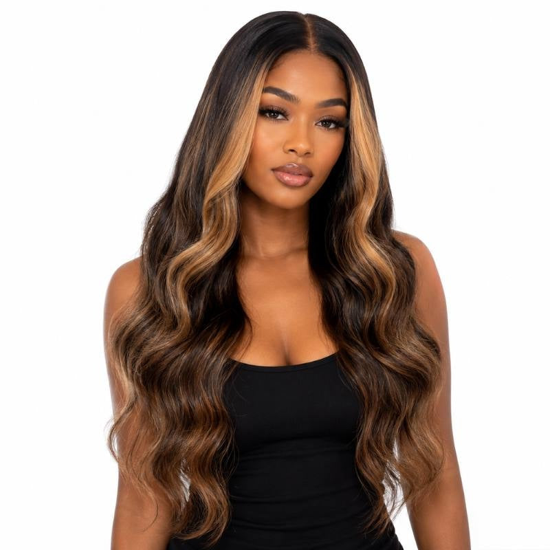 Model wearing a natural black body wave human hair wig with chocolate brown and toffee ombre blending from dark roots into lighter balayage ends