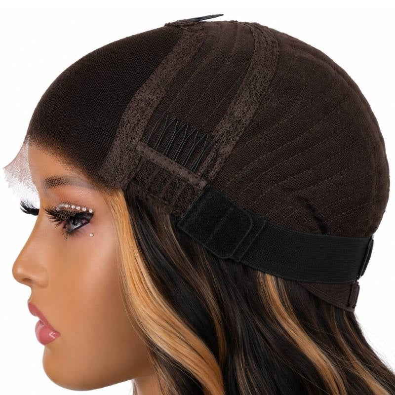 Side of a body wave human hair wig cap on a mannequin showing a comb, the elastic band and honey blonde streaks in the hair below
