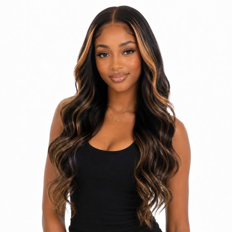 Model wearing a natural black body wave human hair wig with honey blonde balayage streaks running from the face through long waves