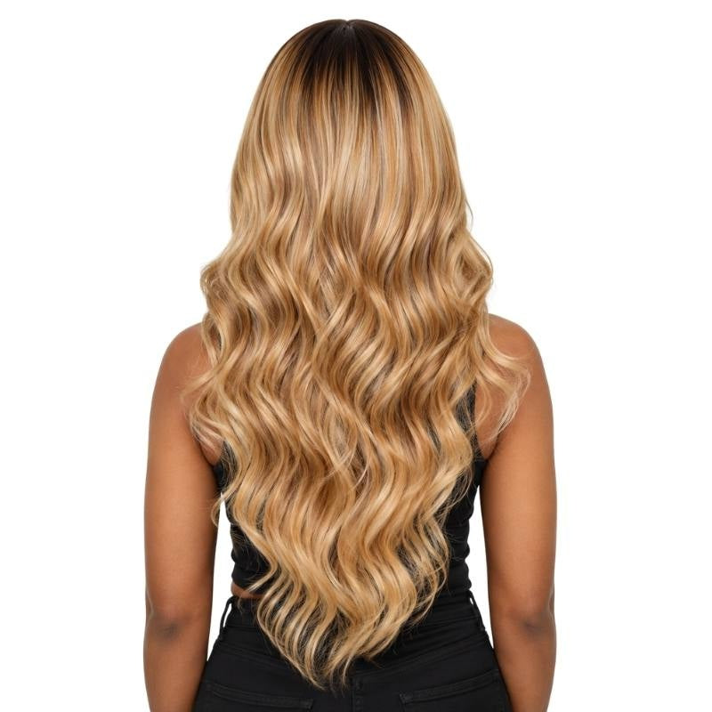 Back view of a chocolate brown to honey blonde ombre body wave human hair wig on a model showing a dark root and blonde waves