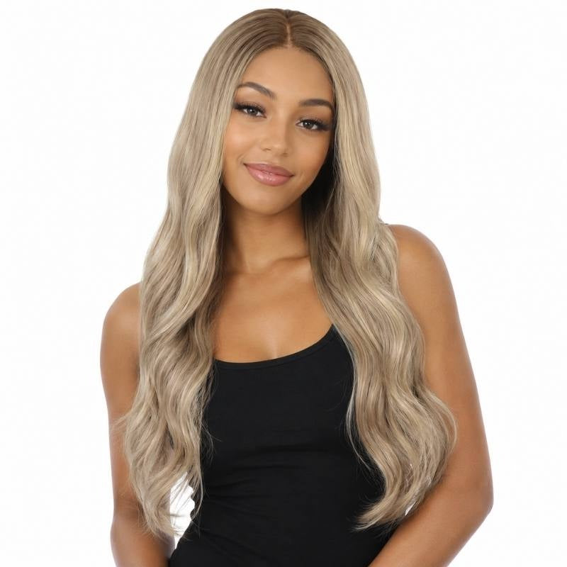 Model wearing a chocolate brown to platinum blonde ombre body wave human hair wig with a darker root and cool blonde waves down the length