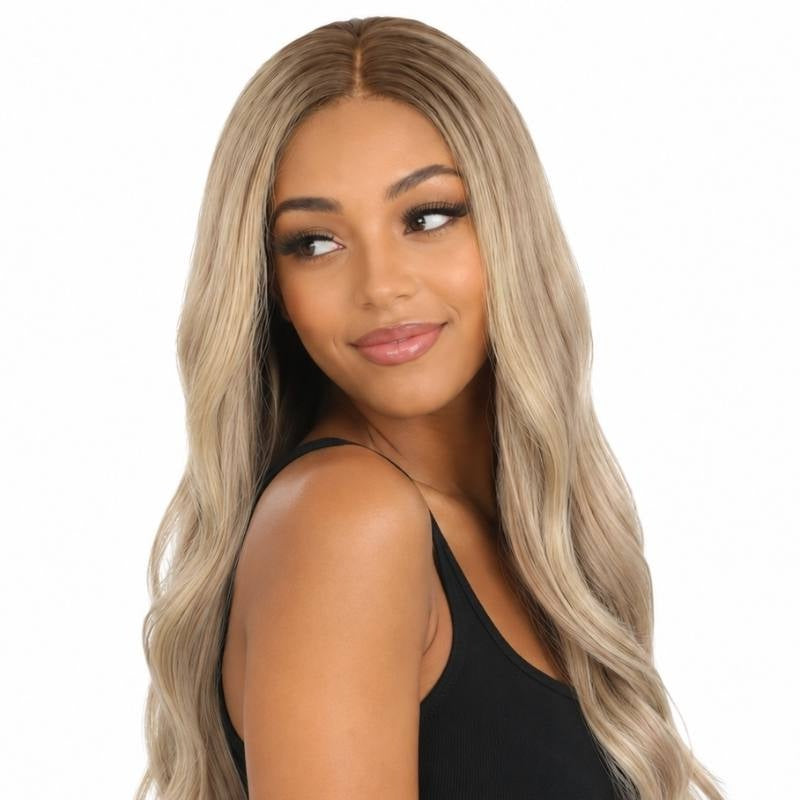 Model looking over the shoulder in a chocolate brown to platinum blonde ombre body wave human hair wig with cool toned blonde lengths