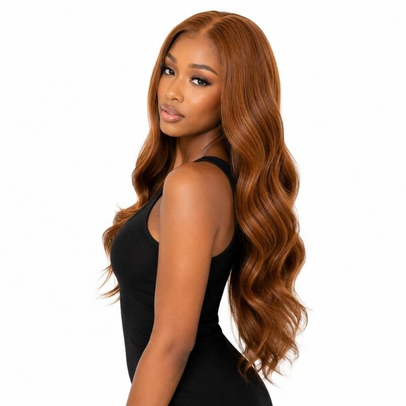 Copper body wave human hair wig on a model turned over the shoulder showing the length and the wave pattern