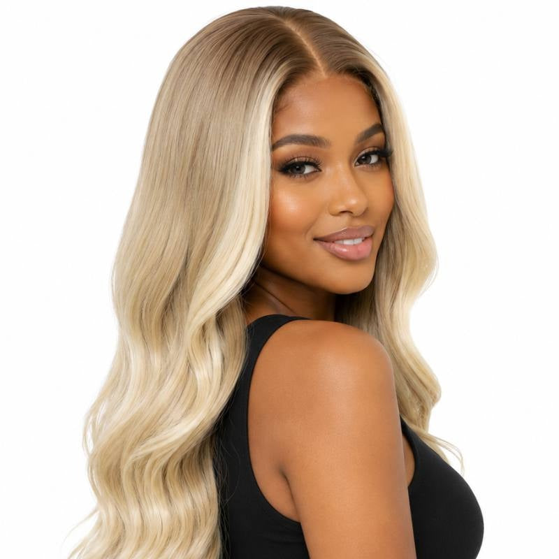 Toffee to blonde ombre body wave human hair wig on a model turned over the shoulder showing the wave pattern and darker roots
