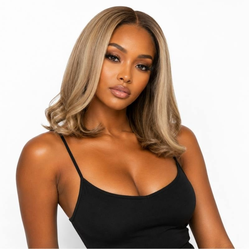 Model wearing a chocolate brown to toffee and platinum blonde straight bob human hair wig with flipped ends at shoulder length
