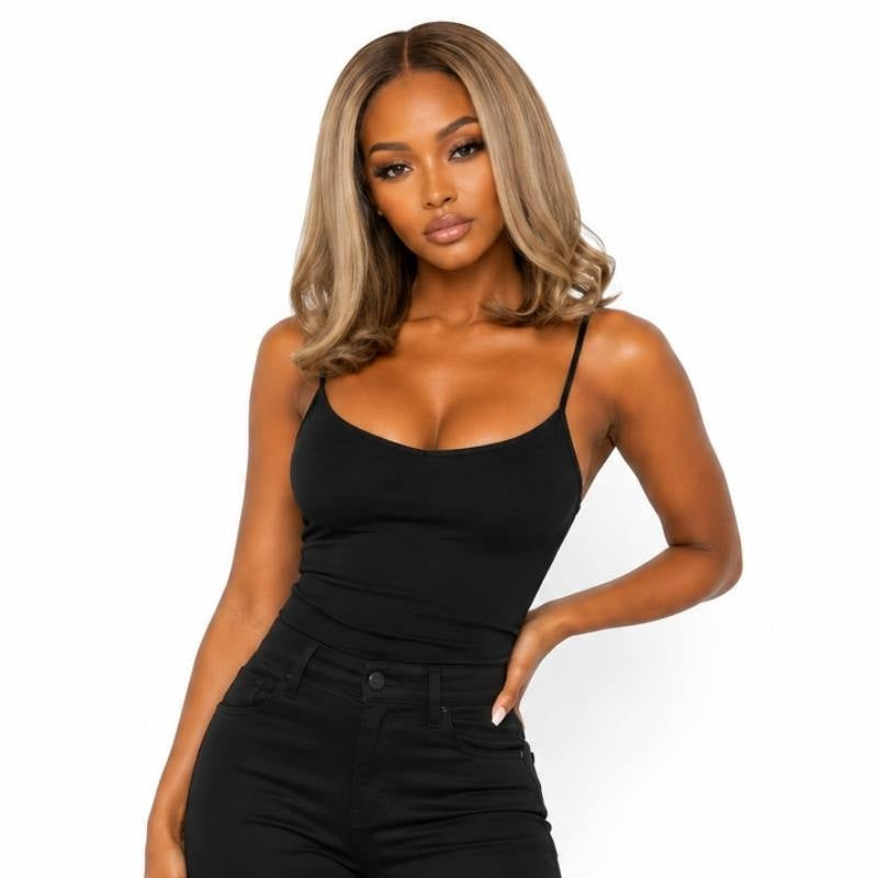Half body view of a model wearing a chocolate brown to toffee and platinum blonde straight bob human hair wig with a middle part
