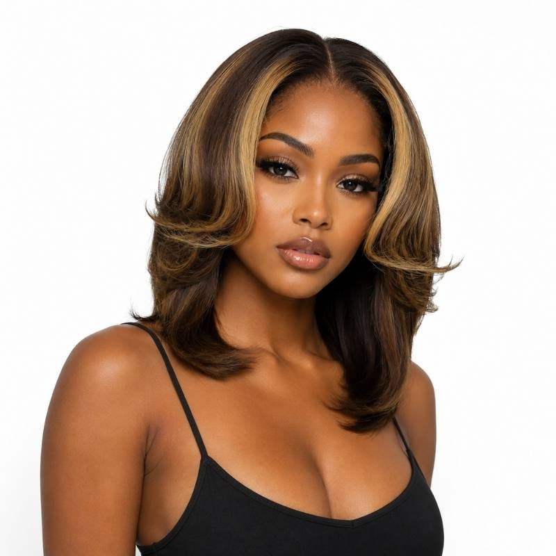 Model wearing a toffee and honey blonde balayage straight bob human hair wig with layered flipped ends framing the face