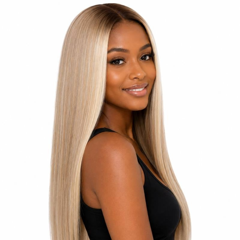 Chocolate brown to ash blonde ombre straight human hair wig on a model turned over the shoulder showing the straight lengths