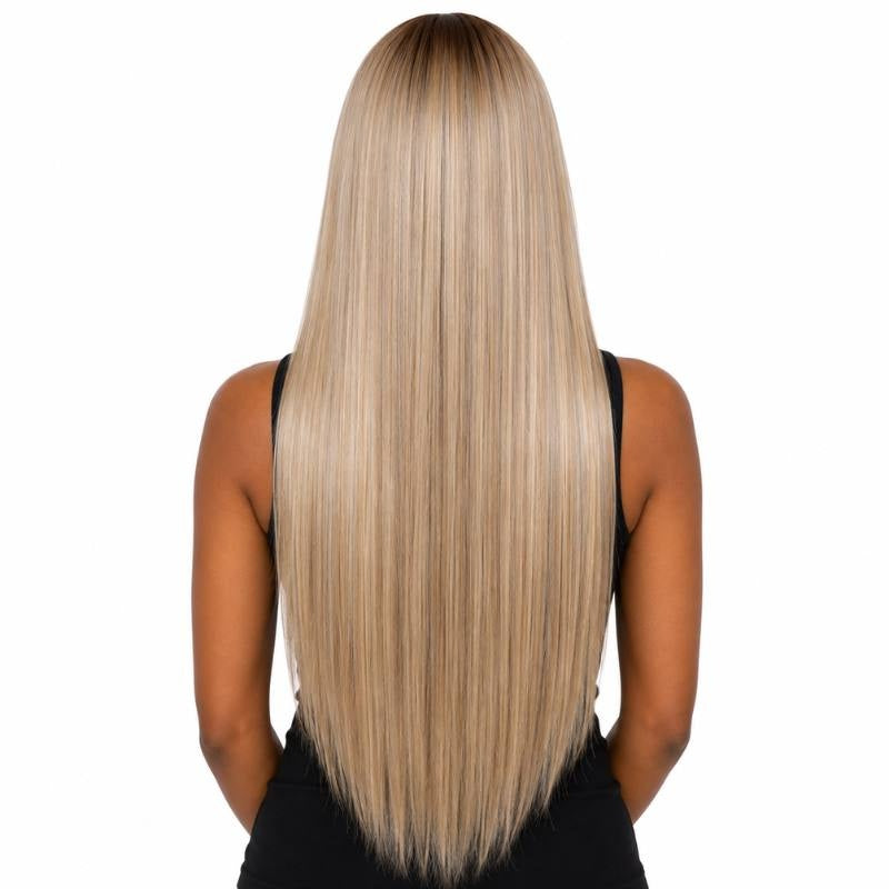 Back view of a model wearing a chocolate brown to ash blonde ombre straight human hair wig showing the straight lengths and the ends