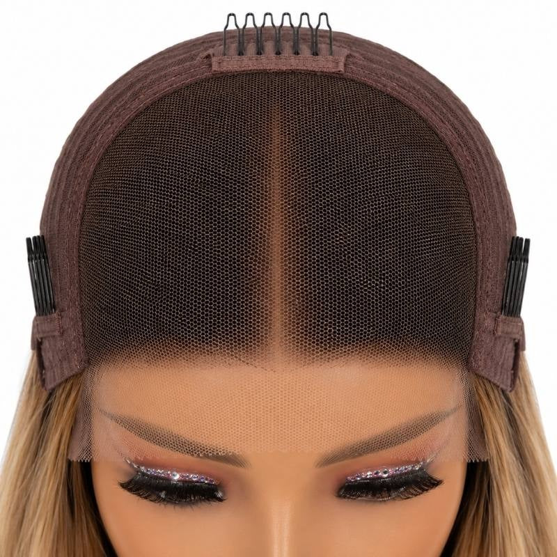 Interior front of the cap on a chocolate brown and honey blonde straight human hair wig showing the brown lace panel and combs at the temples and crown