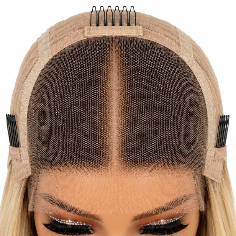 Interior front of the cap on a toffee and blonde balayage straight human hair wig showing the lace panel and combs at the temples and crown